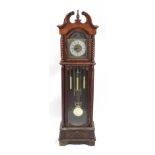 Carved mahogany thirty one day longcase clock with visible pendulum and weights, 205cm high