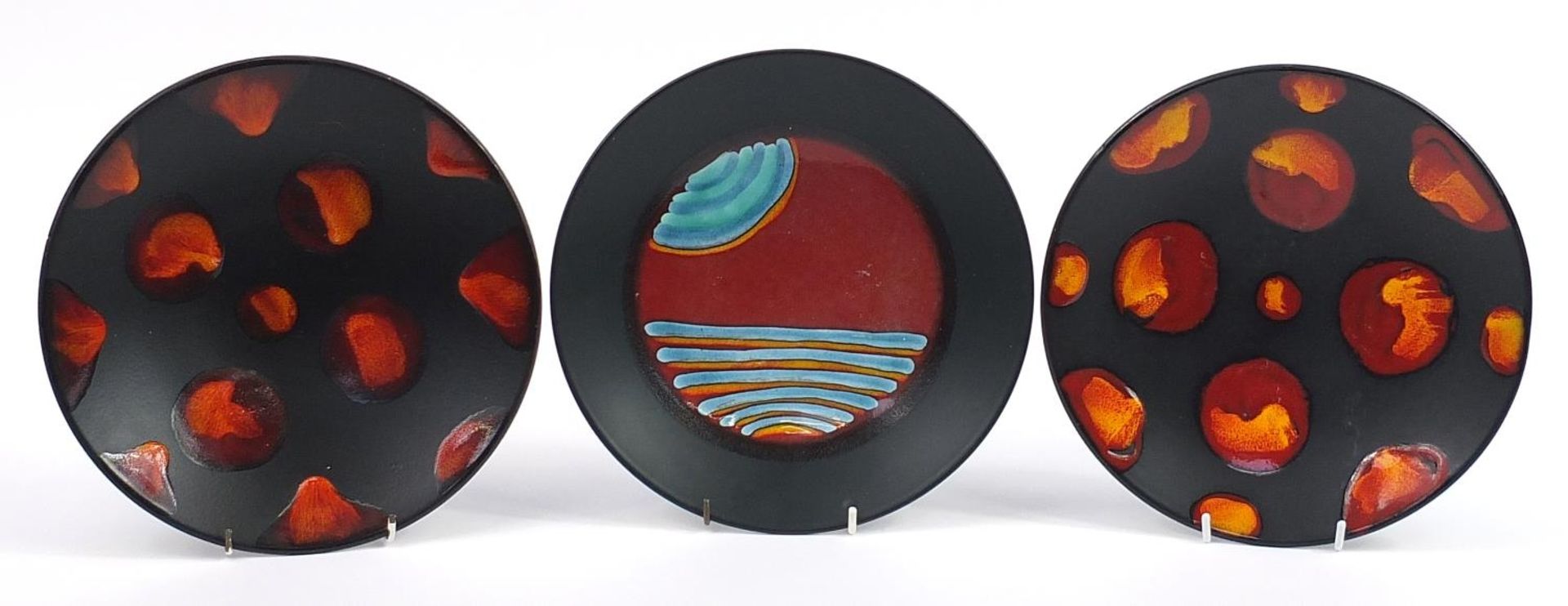 Three Poole Pottery shallow bowls including two Galaxy pattern examples, each 26.5cm in diameter