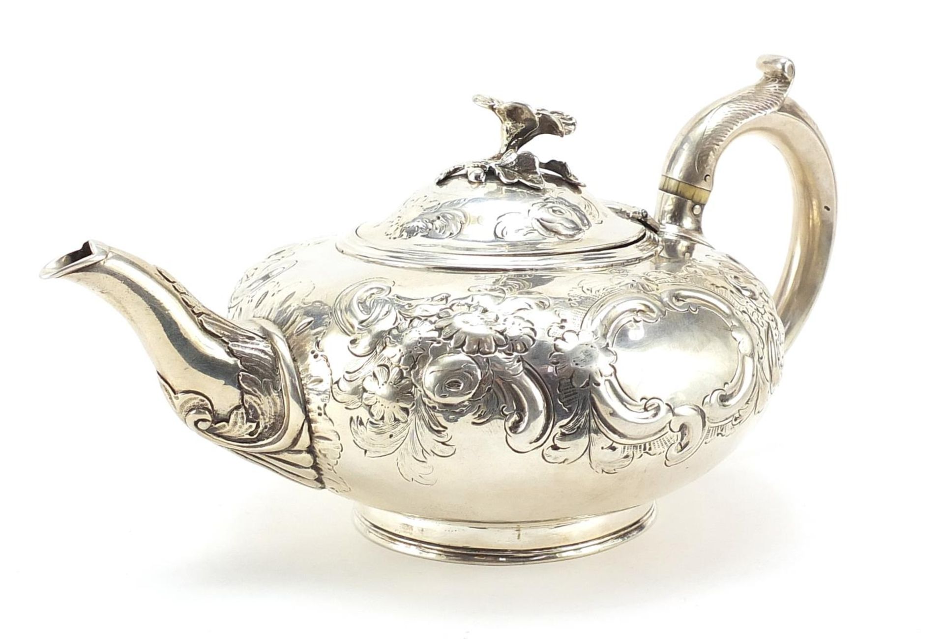 Daniel & Charles Houle, Victorian silver teapot embossed with flowers and blank cartouches, London