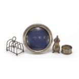 Edwardian and later silver objects including circular easel photo frame, four slice toast rack and