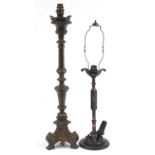 Patinated bronze candlestick converted to a table lamp and one other, the largest 61cm high