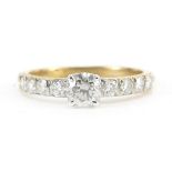 9ct gold diamond ring with diamond set shoulders, the largest diamond approximately 0.45ct, the