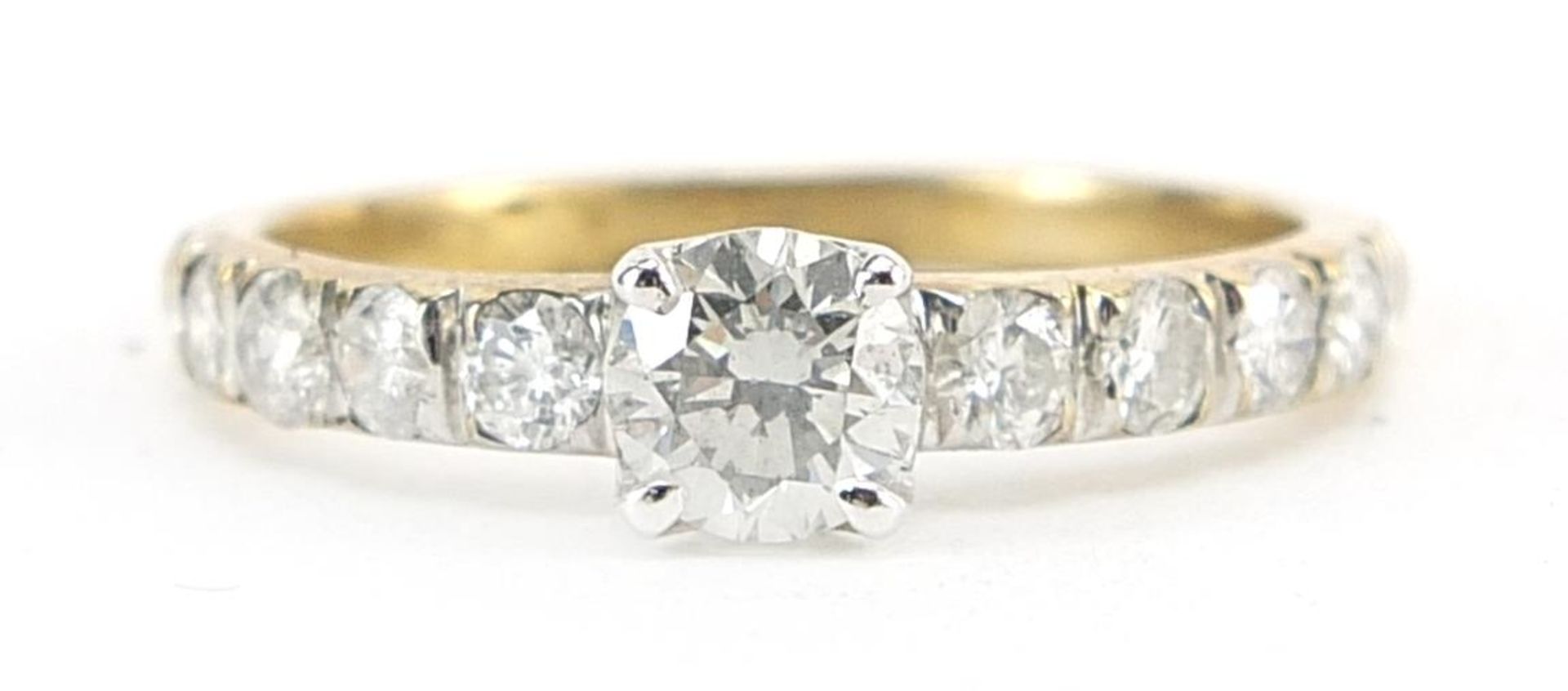 9ct gold diamond ring with diamond set shoulders, the largest diamond approximately 0.45ct, the