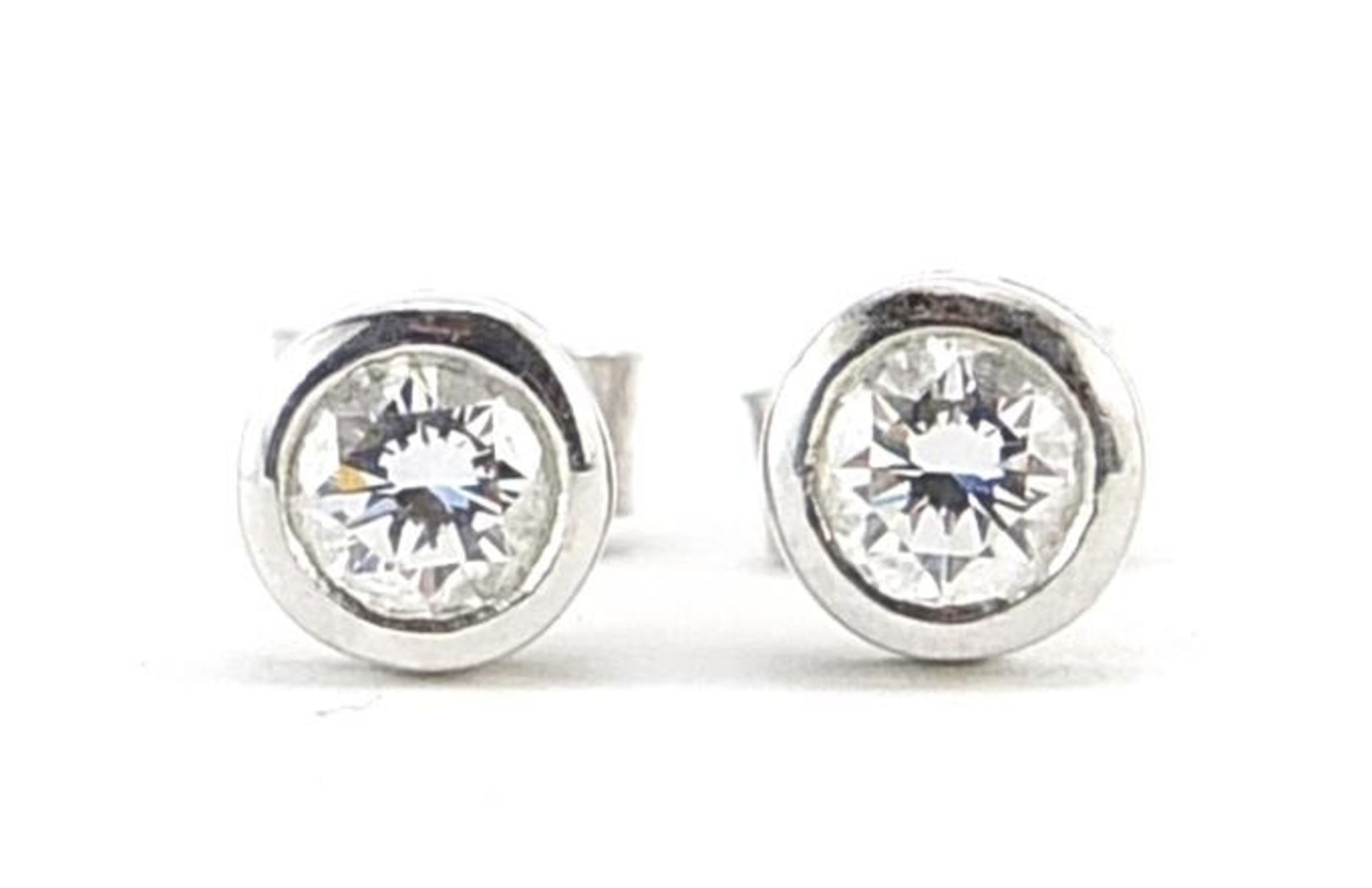 Pair of 18ct white gold diamond stud earrings, 6mm in diameter, 1.9g