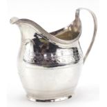 George III silver cream jug with blank cartouche, indistinct maker's mark, London 1802, 10cm high,