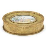 French gilt brass jewel casket engraved with flowers having a hinged lid inset with an oval plaque