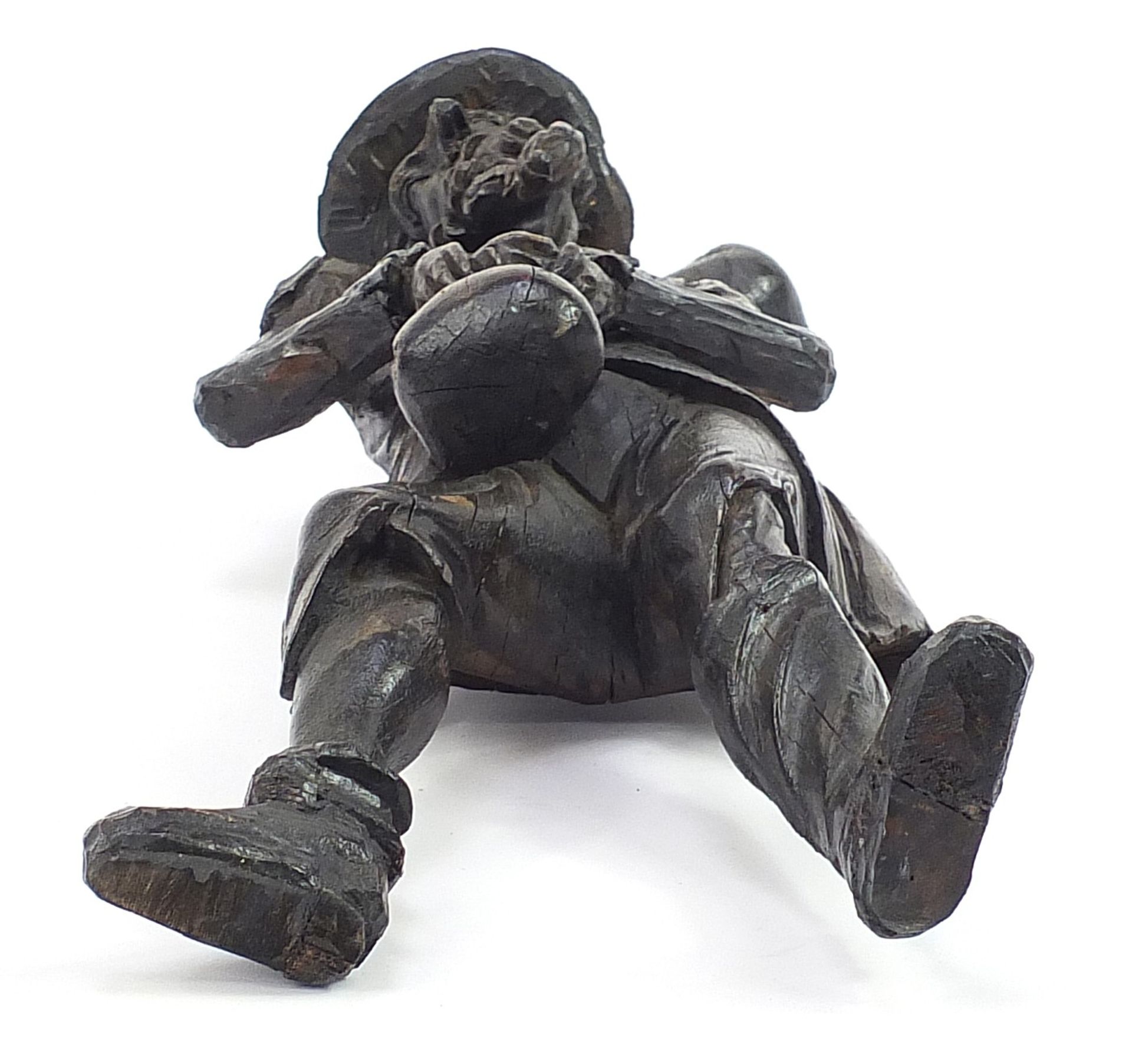 Antique oak carving of a man holding a sack, 61cm high - Image 3 of 3