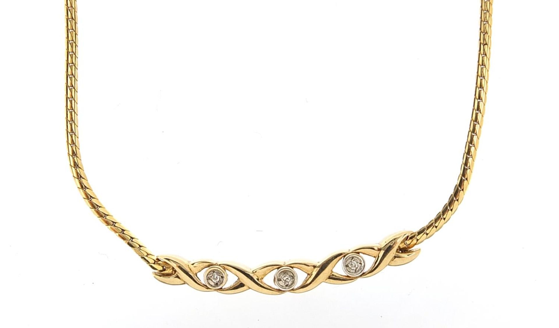 9ct gold necklace set with three diamonds, 41cm in length, 5.9g