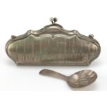 Georgian silver caddy spoon 7.0g and silver plated concertina purse, the largest 13.5cm wide,