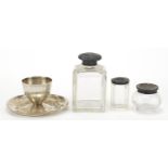 Three cut glass jars with silver lids and a silver egg cup by James Dixon & Sons, the largest 8cm