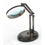 Brass adjustable desk magnifying glass, 29cm high extended