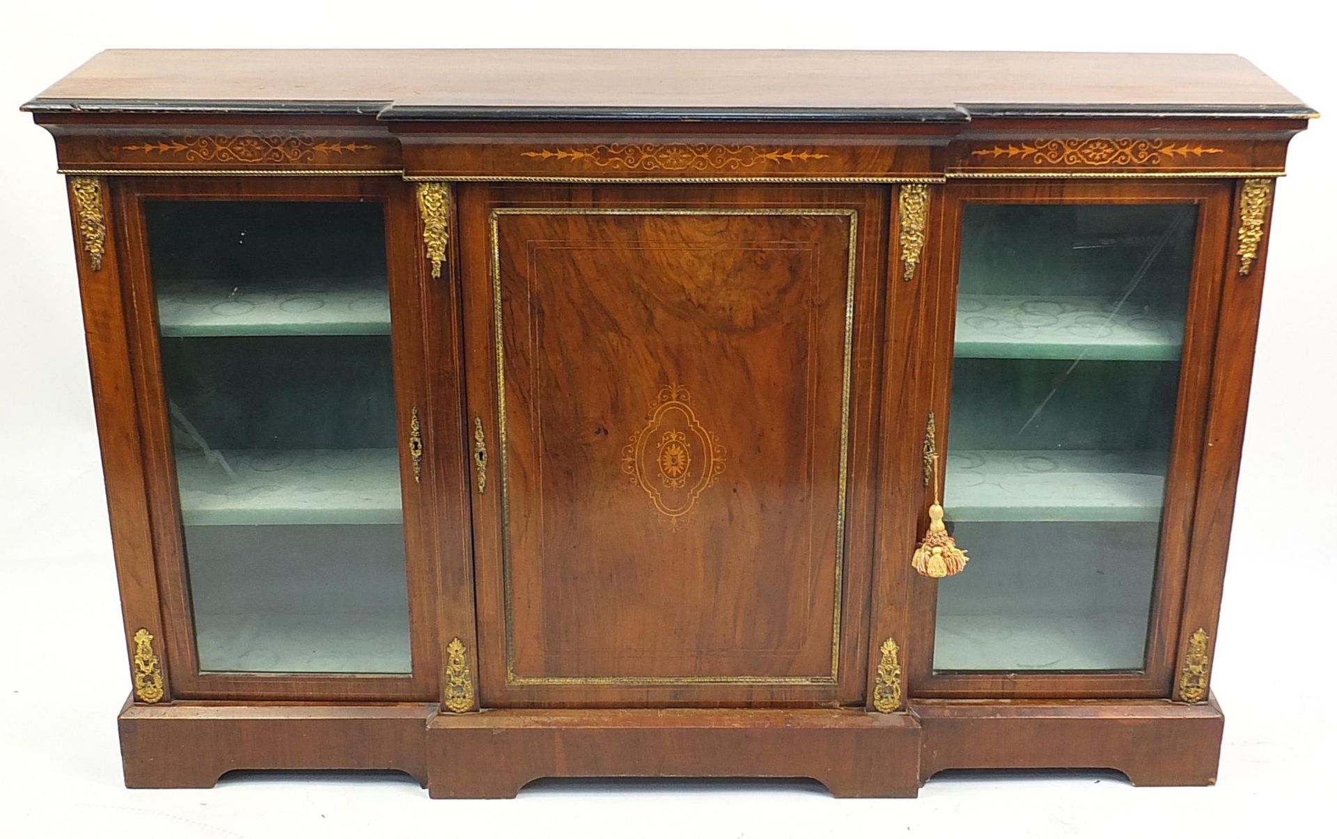 Inlaid breakfront bookcase with a pair of glazed doors, central cupboard door and gilt metal mounts,