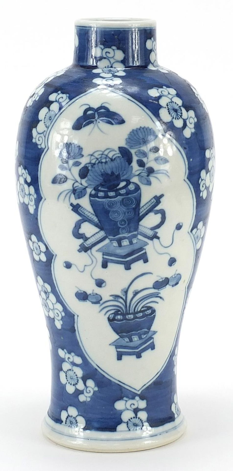 Large Chinese blue and white porcelain baluster vase hand painted with flowers onto a prunus ground,