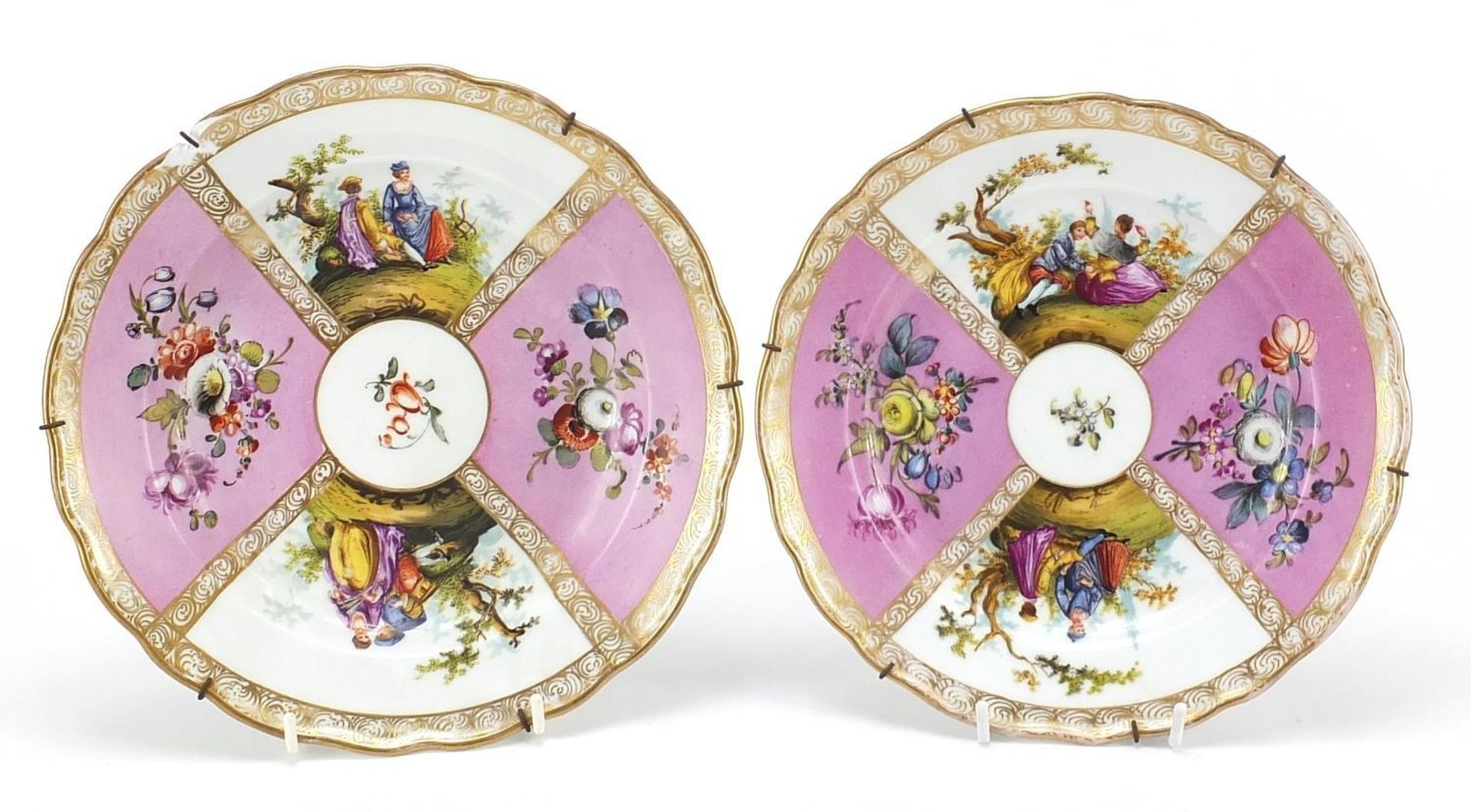 Dresden, two German porcelain plates hand painted with figures and flowers, the largest 24cm in