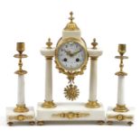 19th century French gilt metal and white marble mantle clock with garniture candlesticks, the