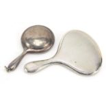 Two miniature silver hand mirrors, one with compact compartment, the largest 8cm in length, total