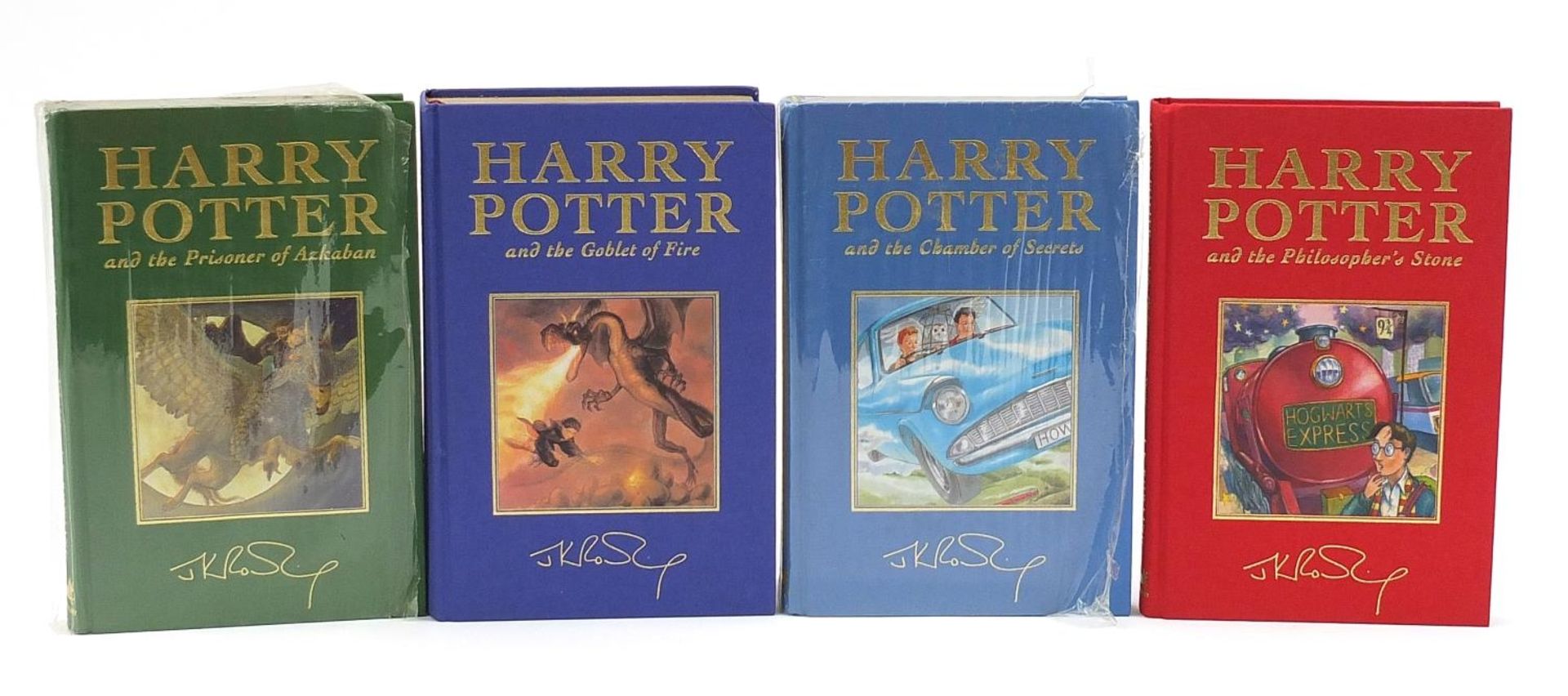 Four Harry Potter Deluxe Edition hardback books including first edition Goblet of Fire