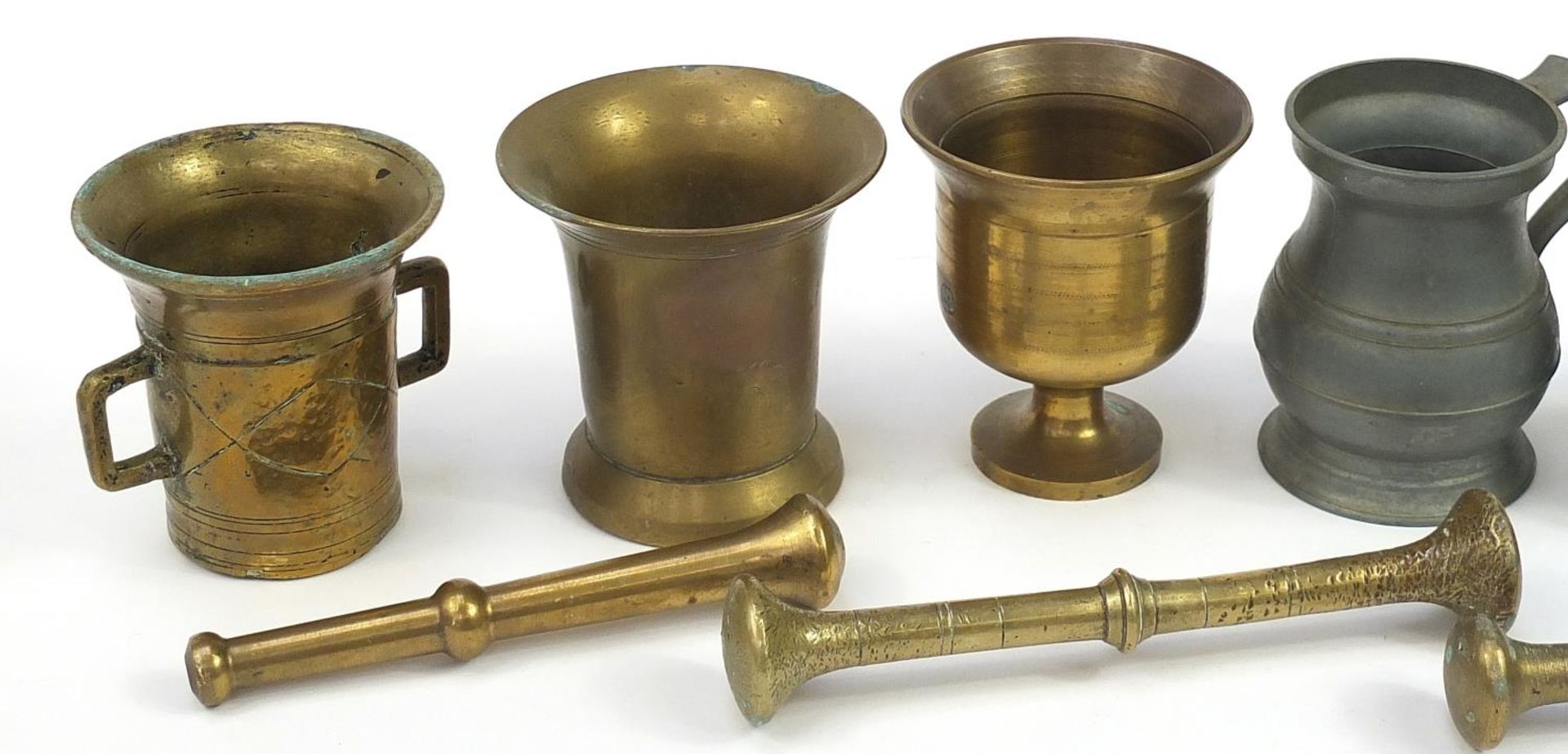 Three bronze pestle and mortars and set of five graduated pewter measures, the largest 24.5cm in - Image 2 of 3