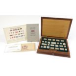 The Stamps of Royalty, twenty five Silver stamp ingots housed in a fitted inlaid wooden case, 35cm