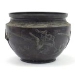 Large Japanese patinated bronze jardiniere cast in relief with birds of paradise, 25.5cm high x 35cm