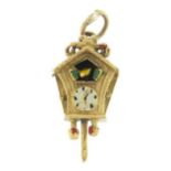 9ct gold and enamel cuckoo clock charm, 2.1cm high, 2.6g