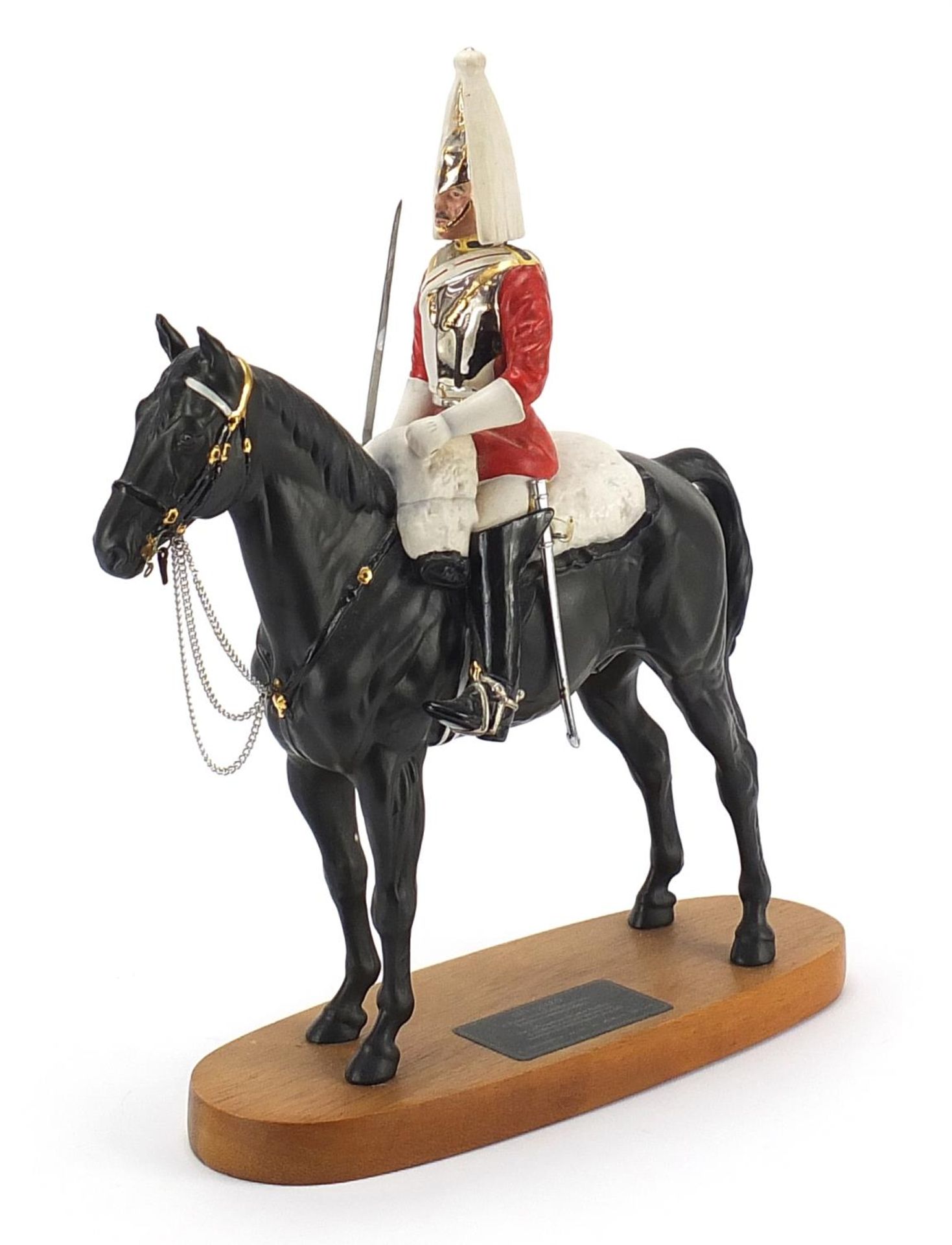 Beswick Connoisseur model of a Lifeguard on horseback raised on a wooden plinth base, 29cm in length