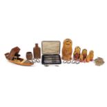 Objects including a Sorento style boat cigarette dispenser, stacking Russian dolls, miniature teak