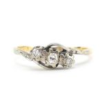 18ct gold diamond three stone crossover ring with indistinct marks, size K, 2.5g