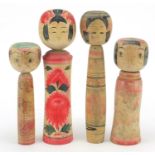 Four Japanese Kokeshi dolls, the largest 30.5cm high