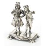 Silver plated model of a young boy and girl, 12cm high