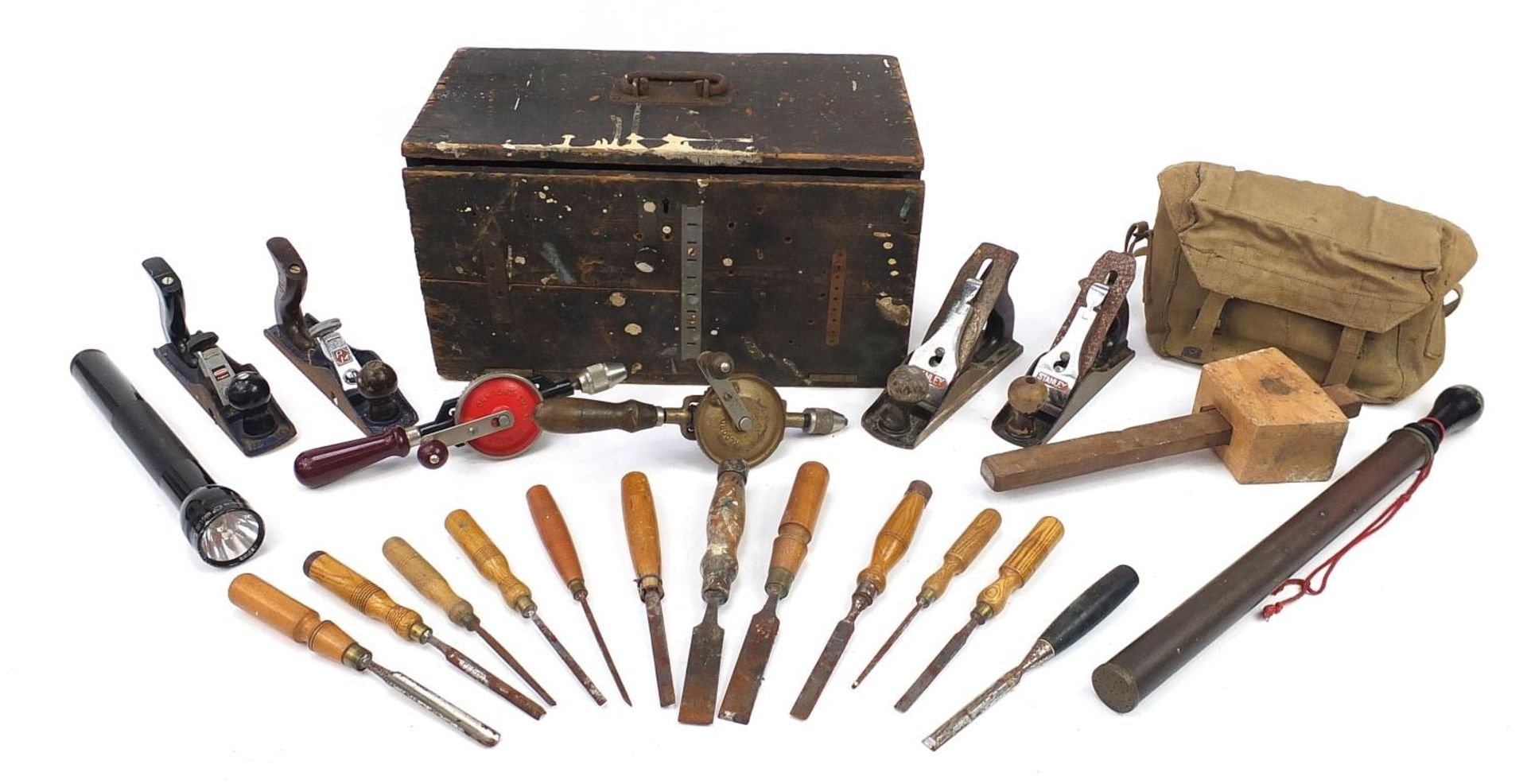 Vintage tools housed in a pine chest including chisels, wood planes and hand drills, the chest