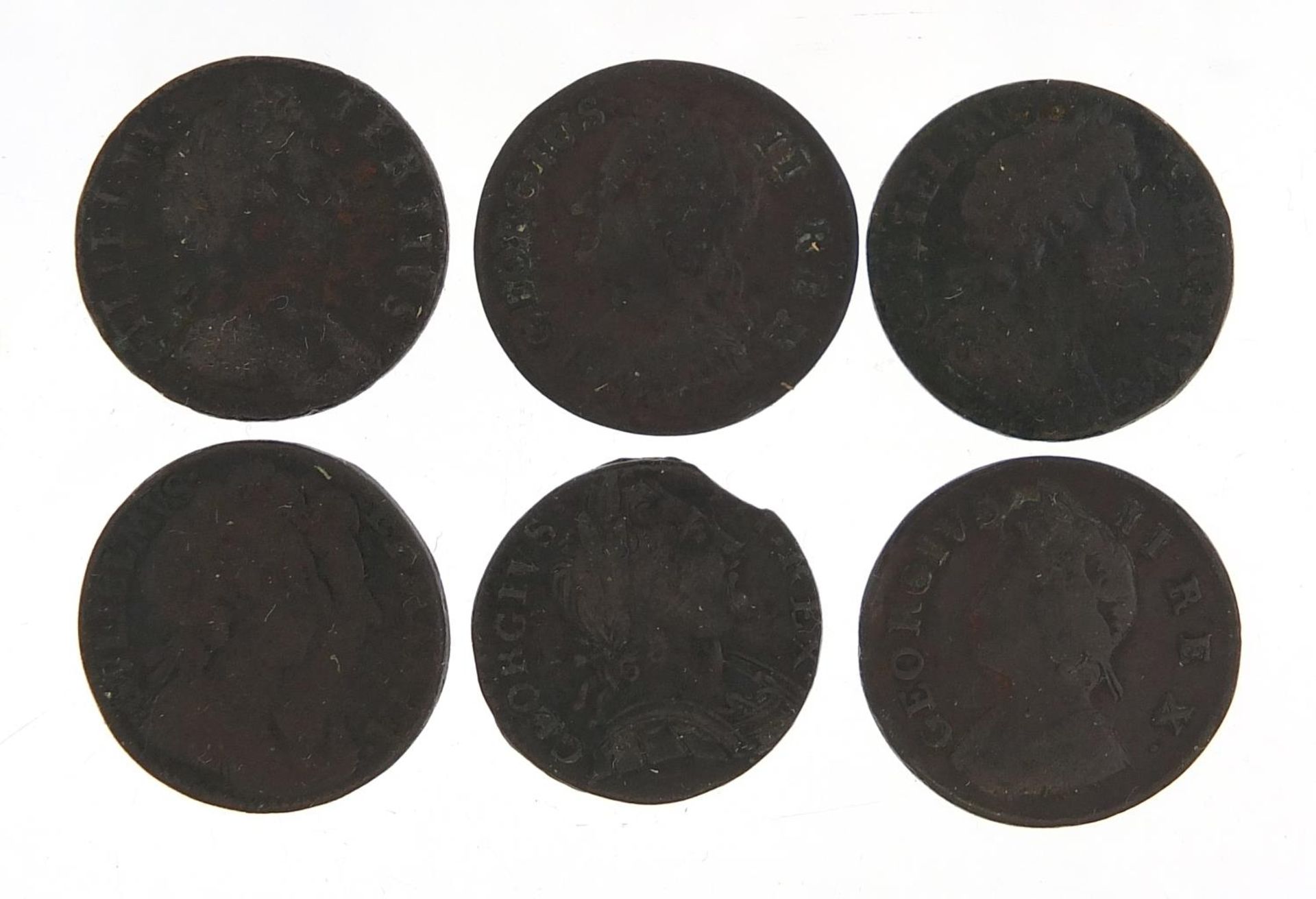 Six William & Mary and later copper farthings including 1694 and 1697