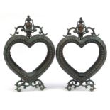 Pair of ornate bronzed love heart tealight holders with glass panels, 52cm high