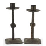 Pair of Arts & Crafts style bronzed candlesticks, each 25cm high