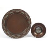 Hugh Wallis, Arts & Crafts copper and pewter plate and dish with floral motif, the largest 28.5cm in