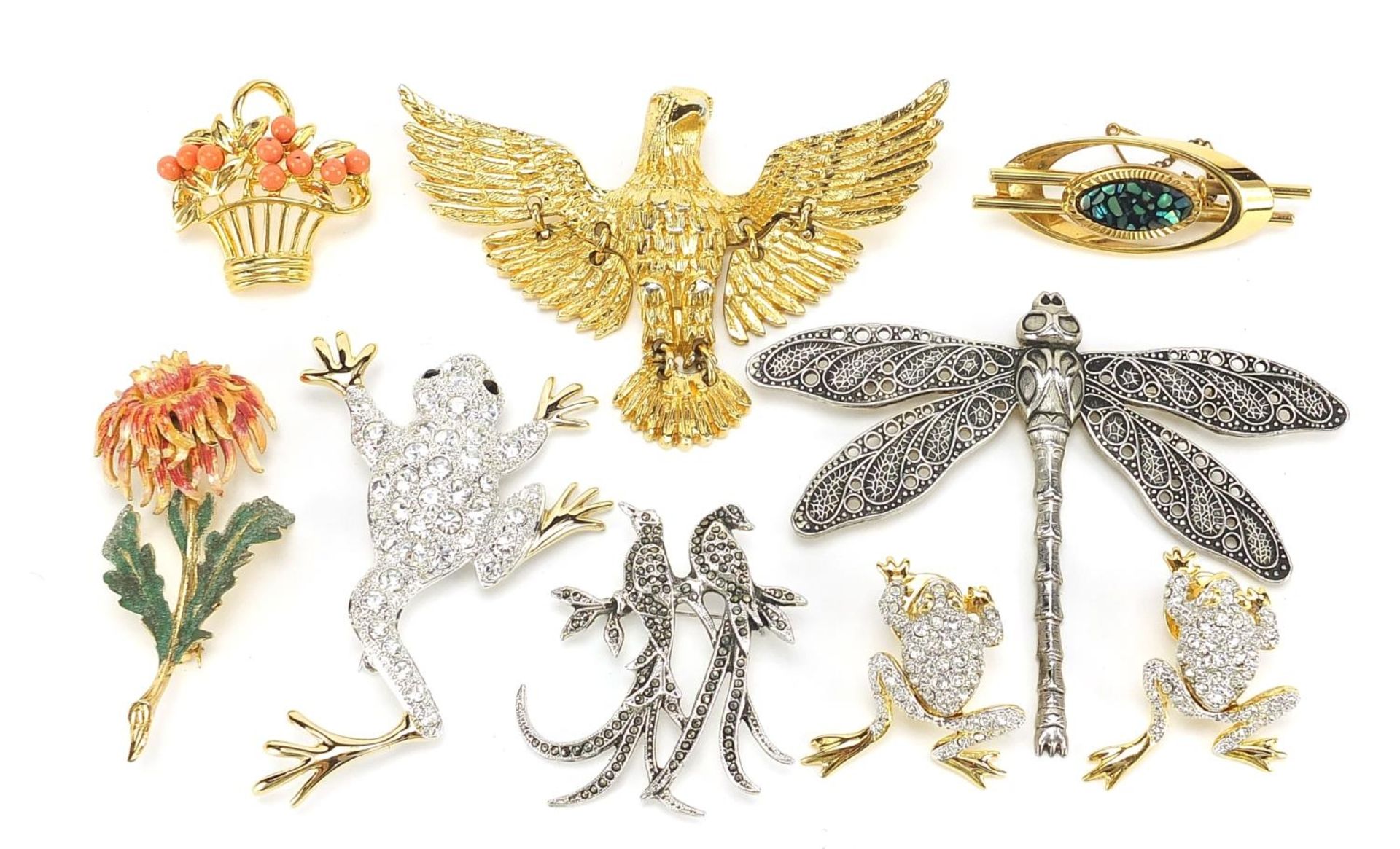 Nine vintage and later brooches and pins including enamelled flower and marcasite example of two