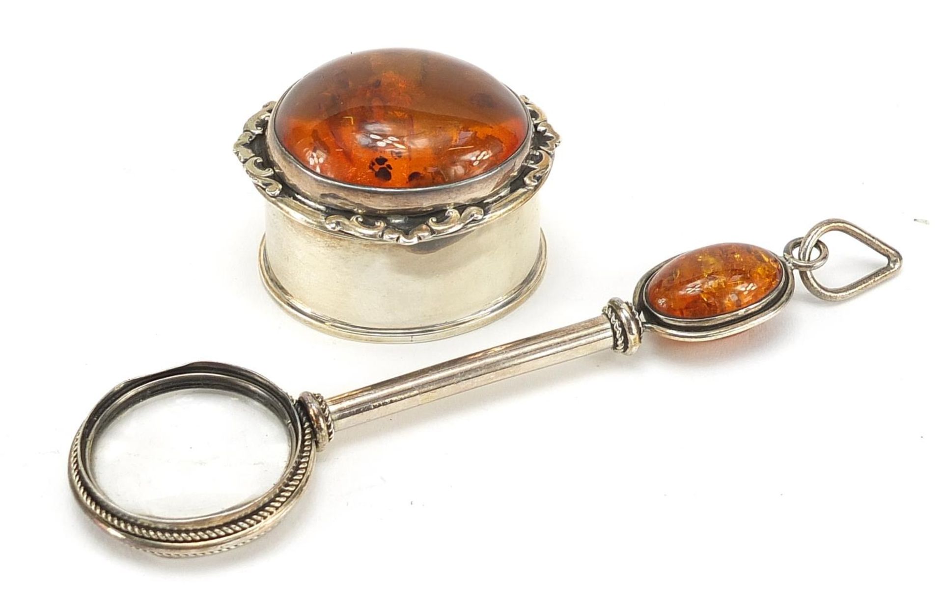 Silver and amber trinket box and magnifying glass, the largest 13cm in length, total 78.5g