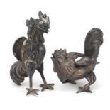 Pair of continental silver fighting cockerels, indistinct impressed marks, the largest 8cm high,