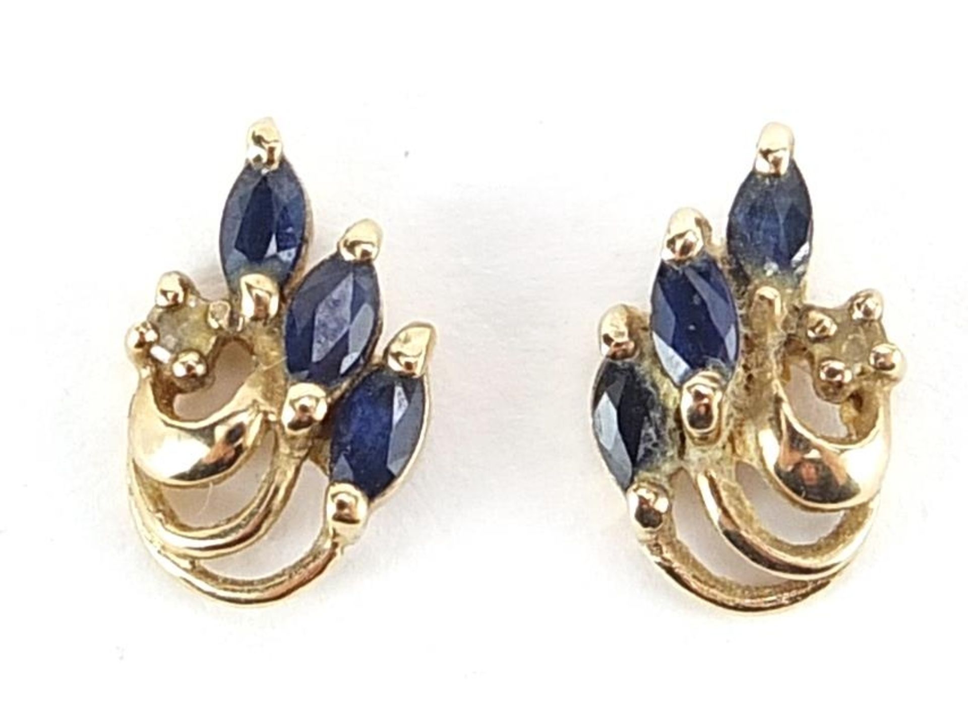 Pair of 9ct gold blue and white sapphire stud earrings housed in a Showerings Taunton box, 1.2cm
