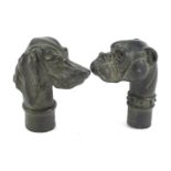 Two patinated bronze dog's head walking stick handles, each 7cm high