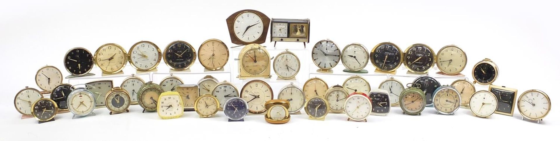 Collection of vintage alarm clocks including Junghans Kienzle, Westclox Big Ben Repeater, Smith