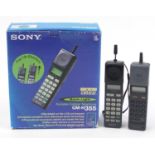 Two vintage Sony portable cellular telephones, one with box, model CM-H355