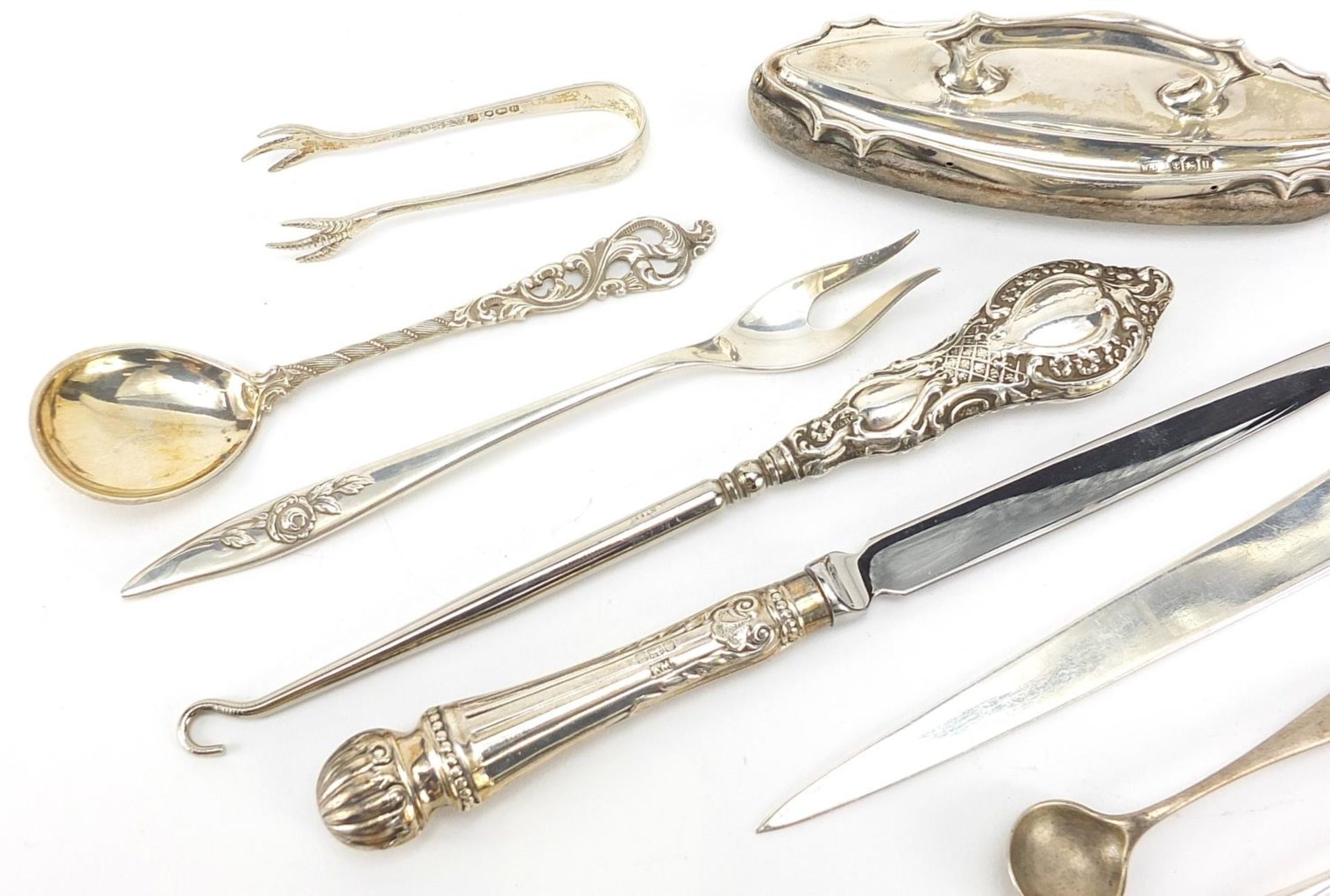 Silver objects including a Maltese letter opener, mustard spoons and sugar tongs, various hallmarks, - Image 2 of 5