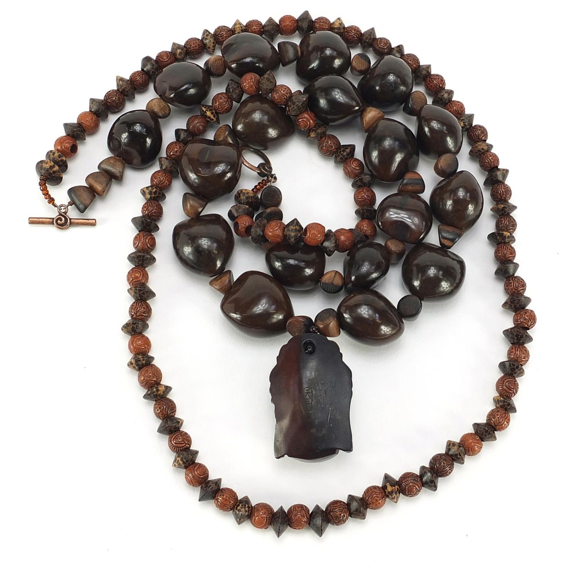 Two Asian bead necklaces including one with Chinese carved netsuke of a Buddha head - Image 3 of 4