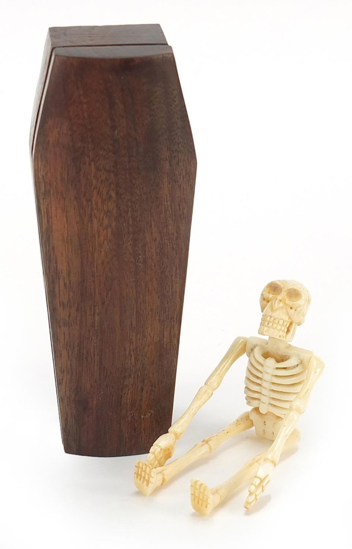 Japanese carved wood coffin enclosing an articulated bone skeleton, 11.5cm high