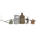 Collection of vintage metalware including milk churn and watering cans, the largest 55cm high