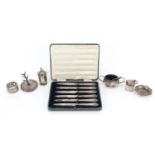 Silver items including cruets, ring tree and set of six silver handled butter knives with steel