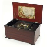 Faux rosewood and ebonised Swiss music box playing on ten airs with bells, 22cm H x 47cm W x 27.