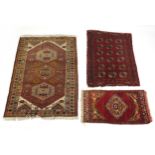 Three Middle Eastern rugs with all over geometric design, the largest 145cm x 102cm