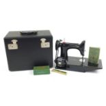 Victorian black enamel sewing machine with carry case, model 221K, the case 36cm wide